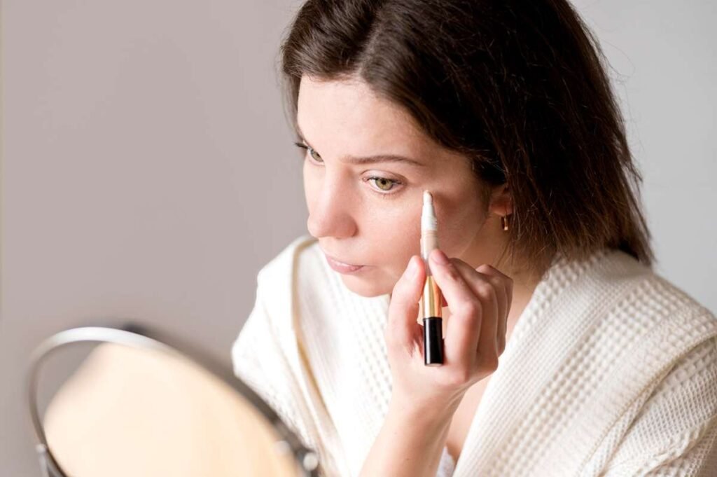 Woman gently applying light makeup after Botox for smoother skin
